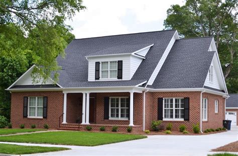 red brick ranch house with metal roof|black roof for red brick house.